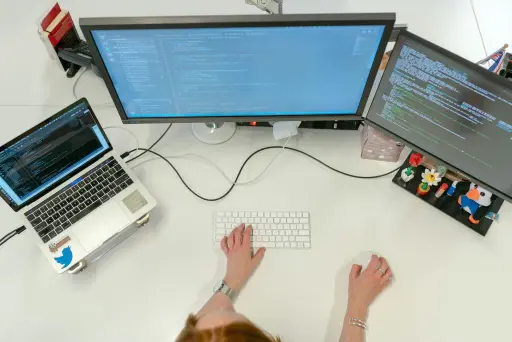 Person using computers at work